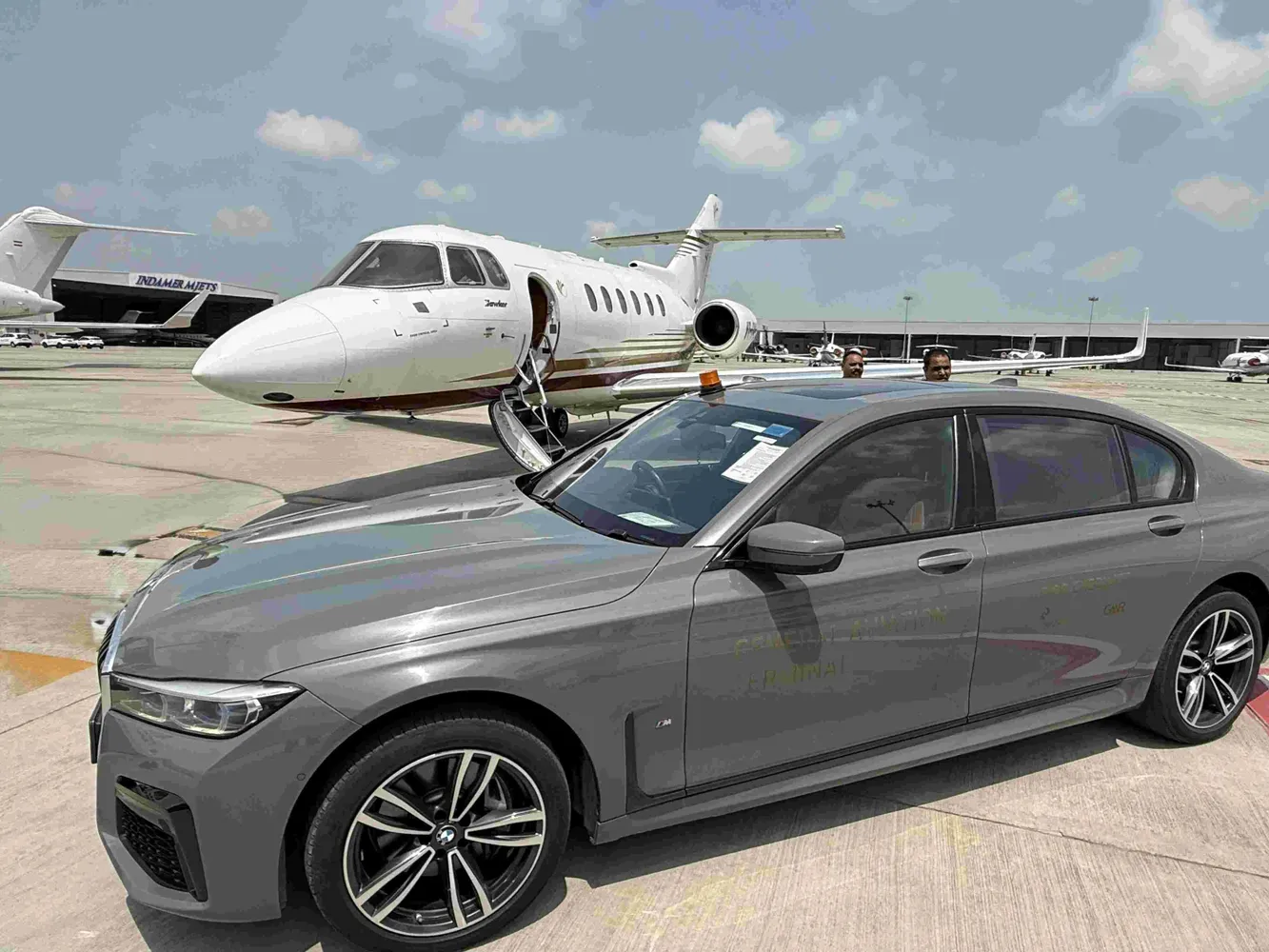 Private jet and car prepared on the apron